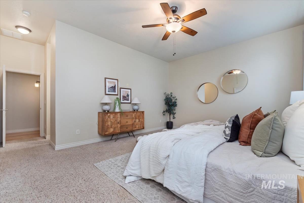 Bedroom with baseboards and a ceiling fan