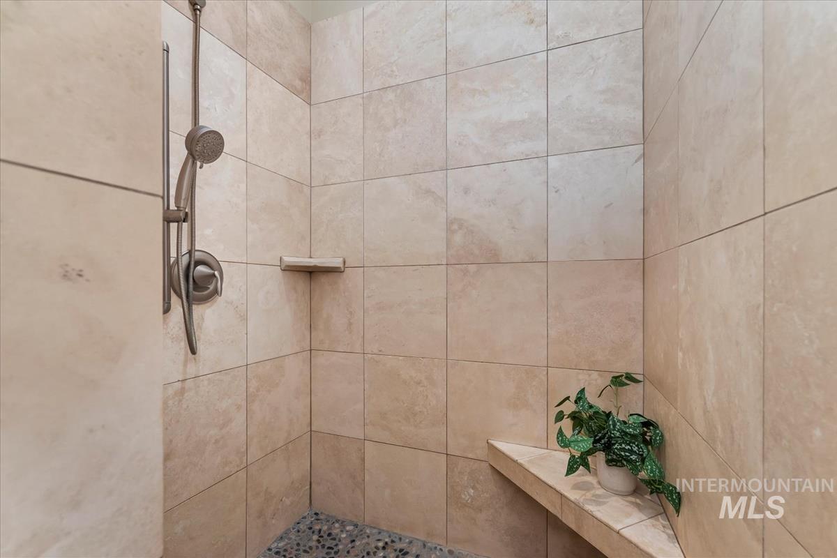 Bathroom featuring tiled shower