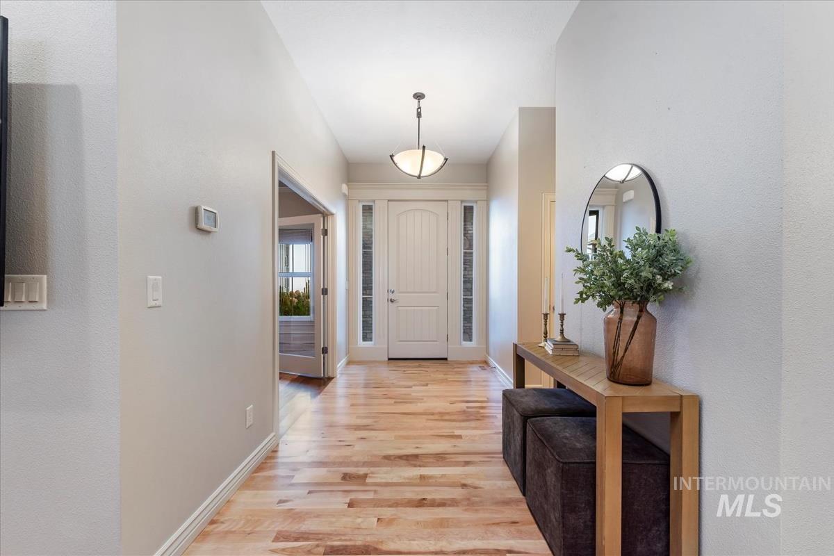 Entryway featuring light wood-type flooring and baseboards