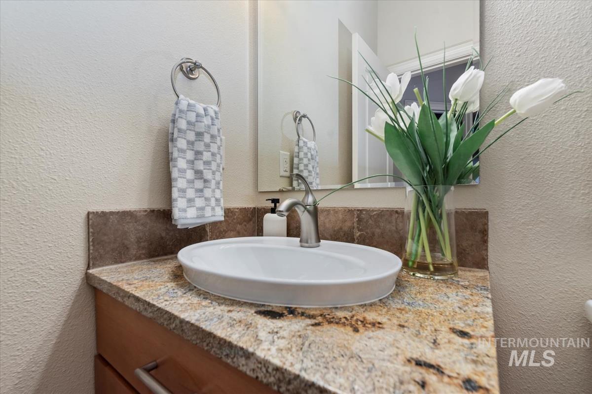 Bathroom view of a textured wall and vanity