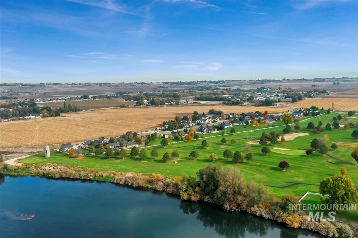 Aerial view of sparsely populated area with a nearby body of water