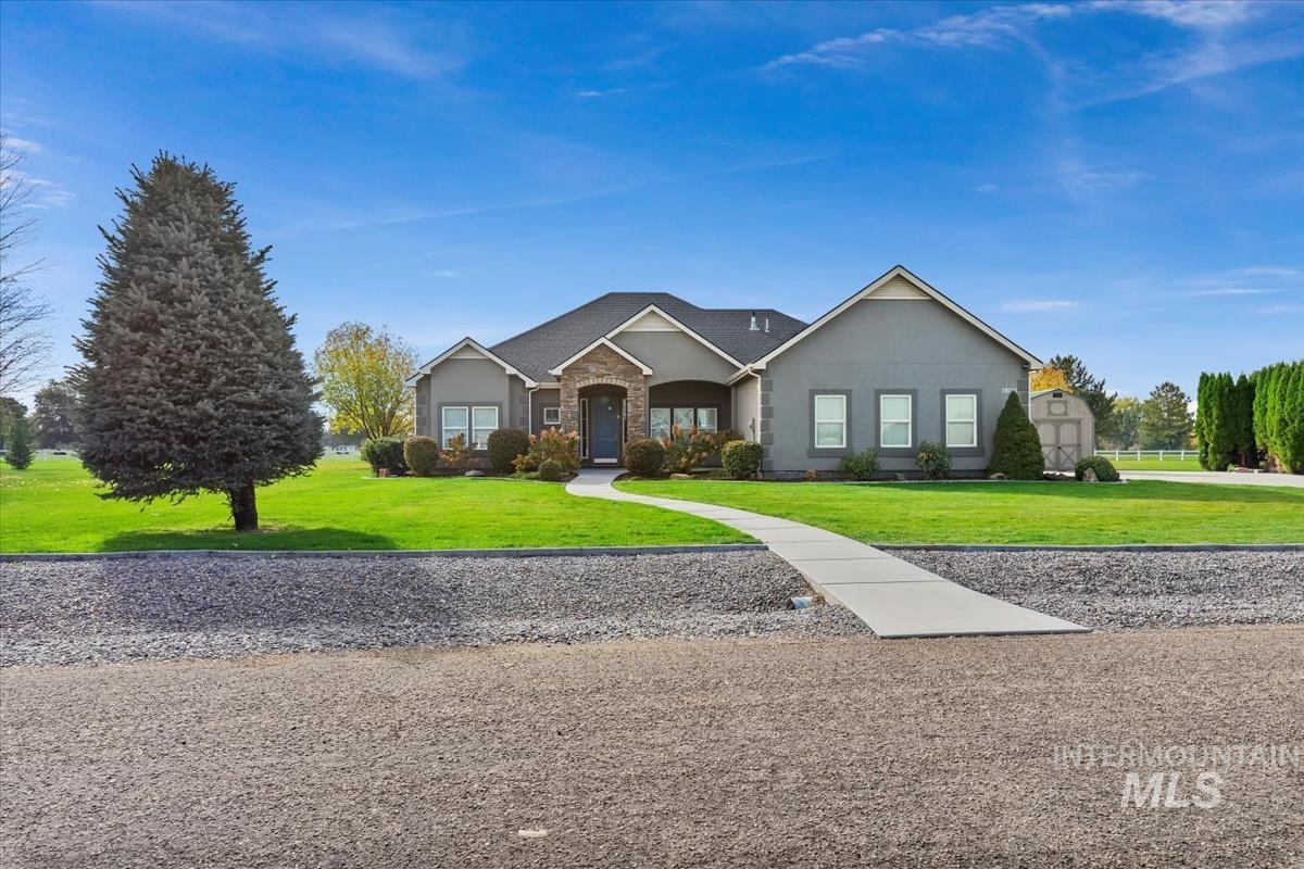 Single story home with a front yard and stucco siding