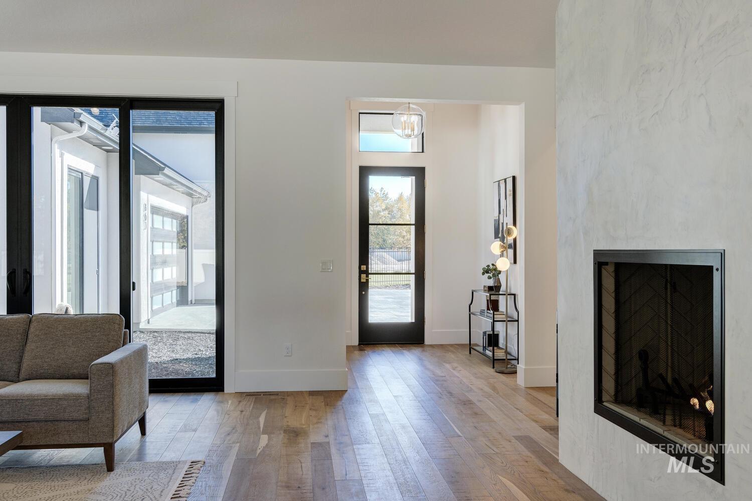 Entryway featuring a fireplace and light wood-type flooring