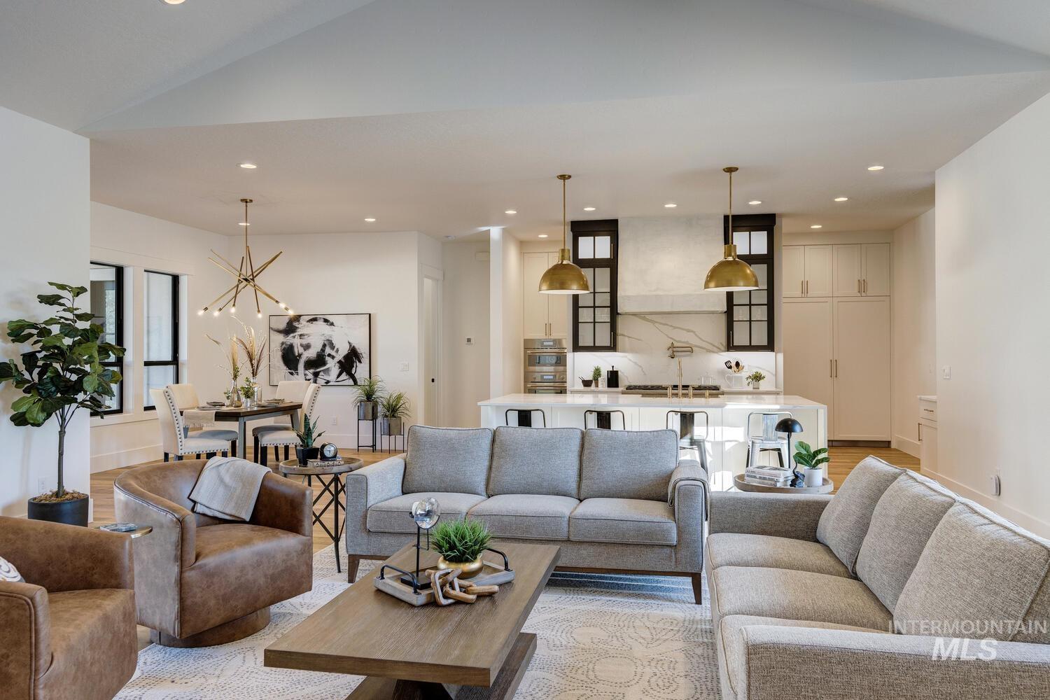 Living room featuring light wood-style floors, recessed lighting, and a chandelier