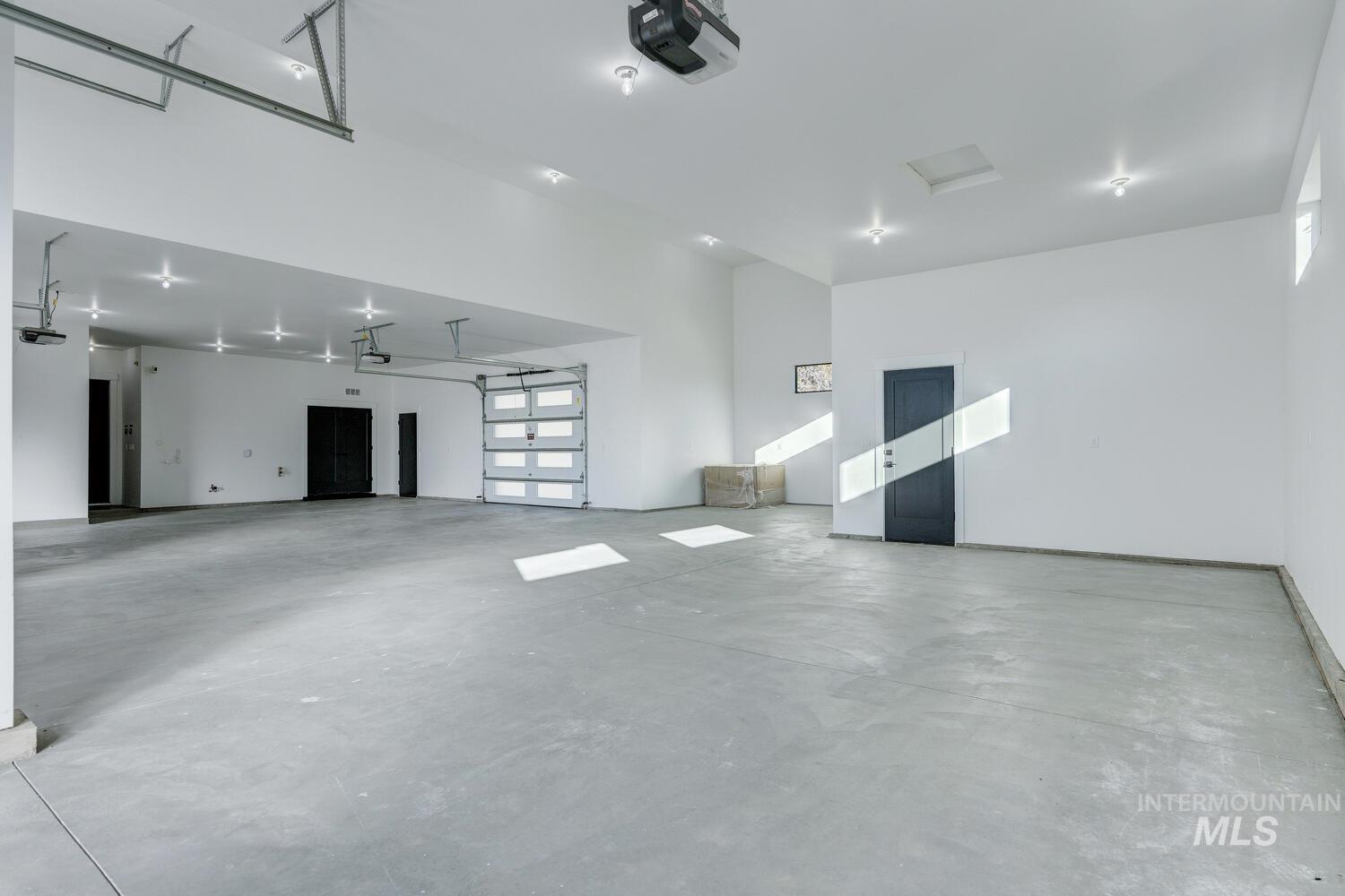 Garage featuring a garage door opener