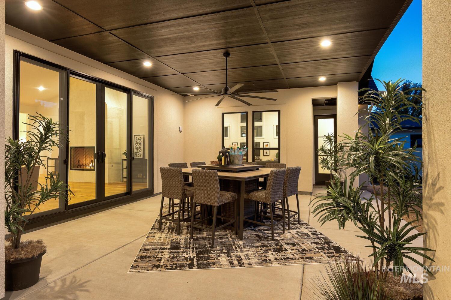 View of patio / terrace with outdoor dining space and ceiling fan