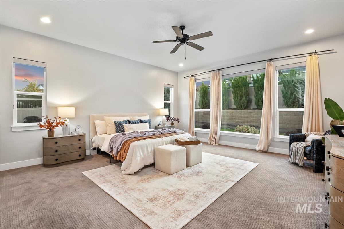 Bedroom featuring carpet floors, a ceiling fan, and recessed lighting
