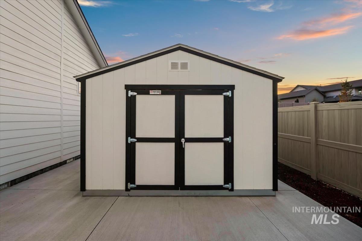 Outdoor structure at dusk with a storage unit