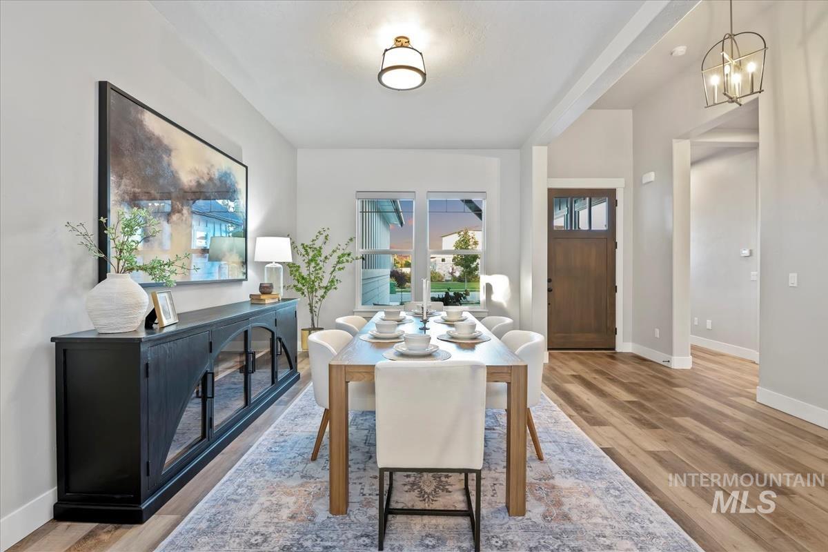 Dining room featuring baseboards and light wood finished floors