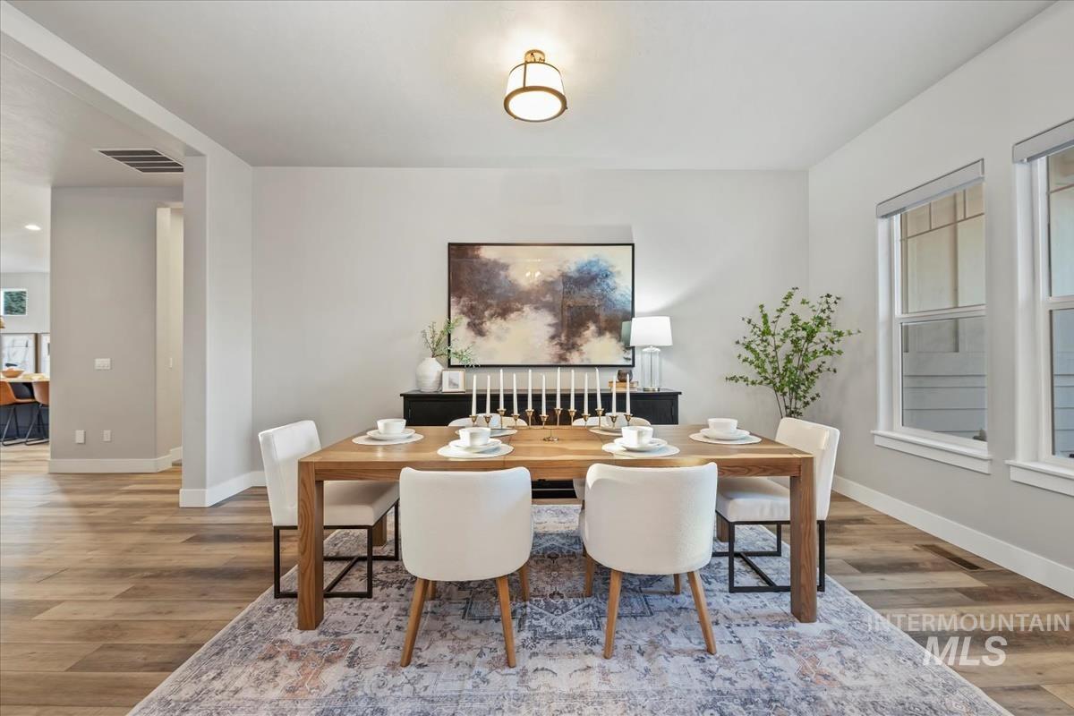 Dining area featuring light wood finished floors