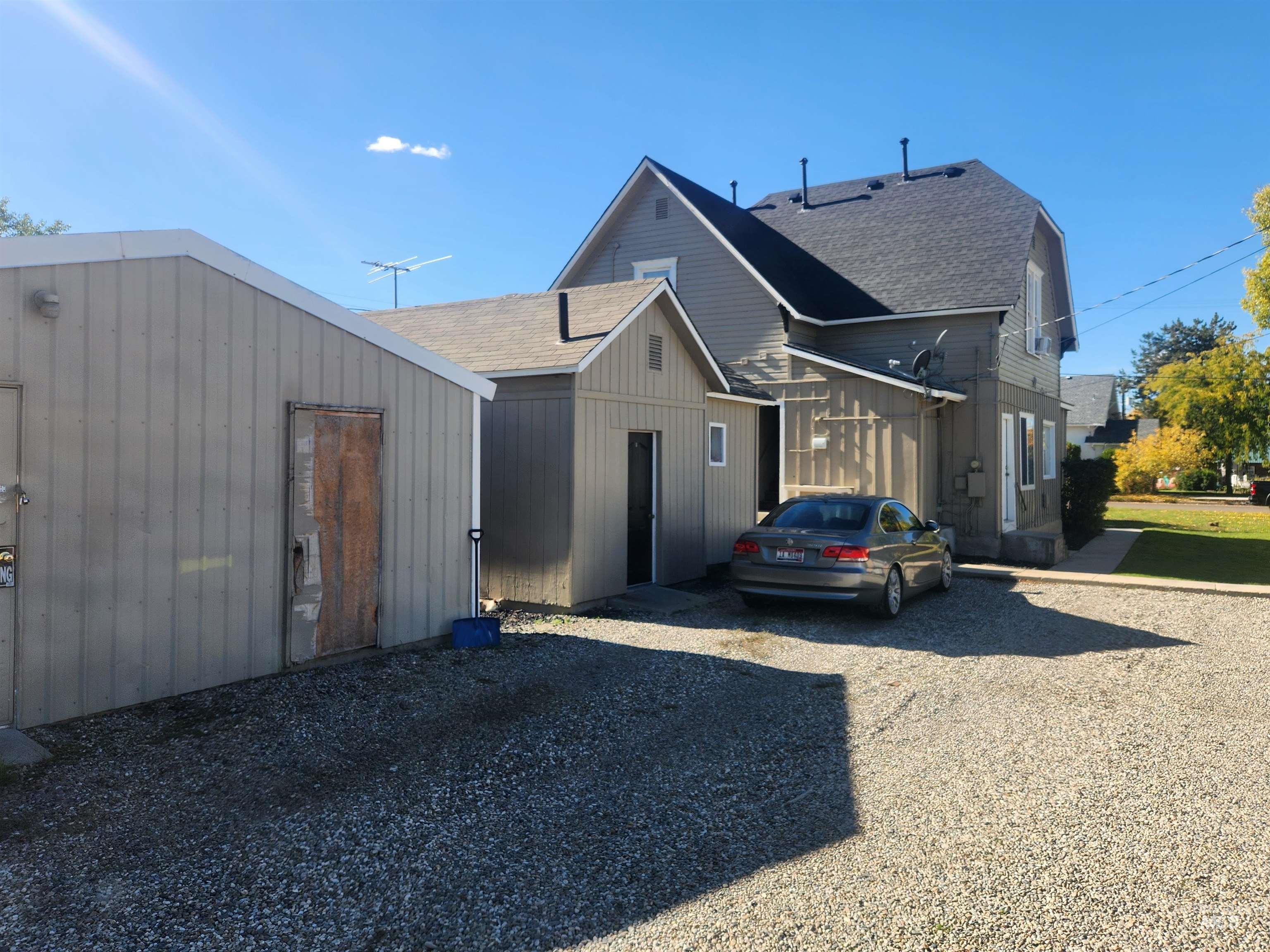 View of front facade featuring a shingled roof