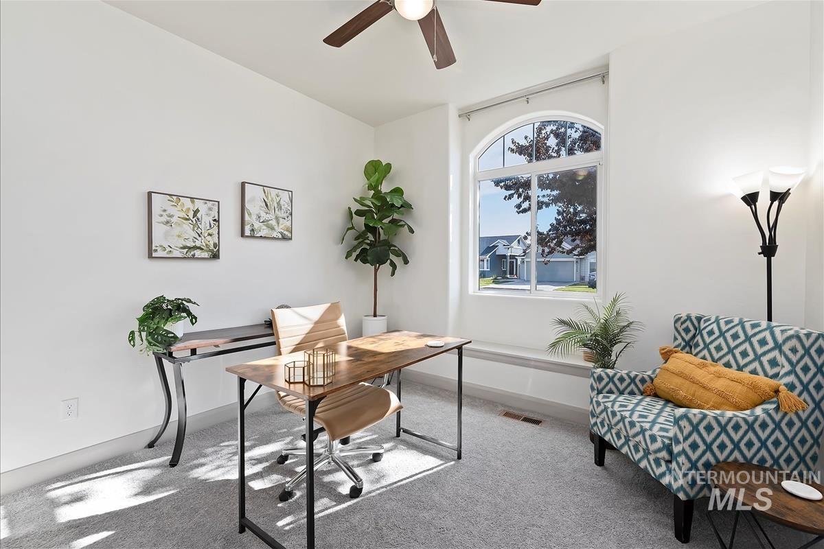 Office with carpet and ceiling fan