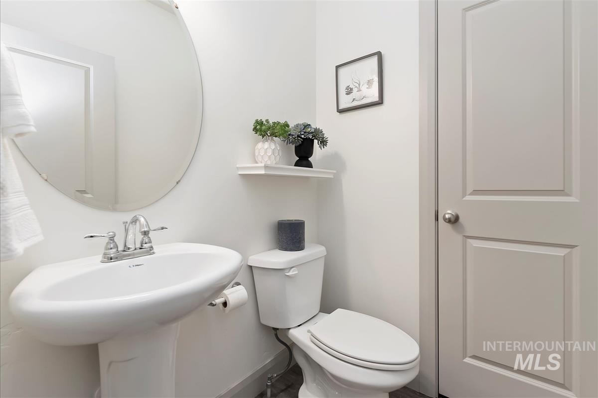 Bathroom with toilet and baseboards