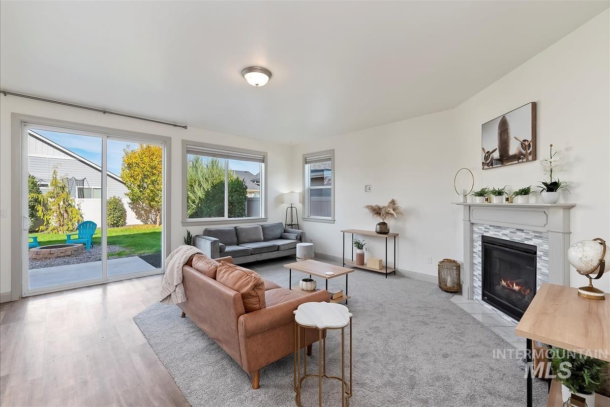 Living area with a fireplace and light wood finished floors