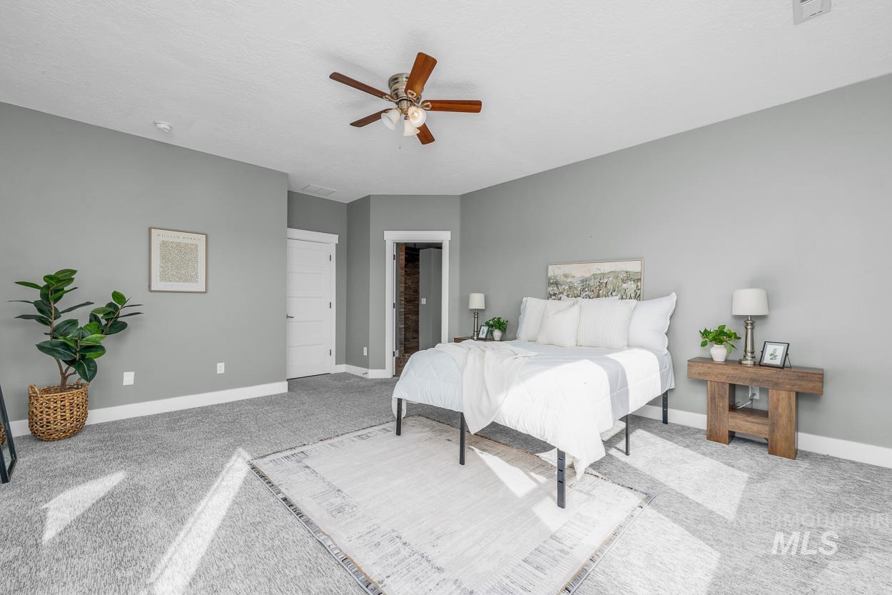 Bedroom featuring carpet flooring and ceiling fan
