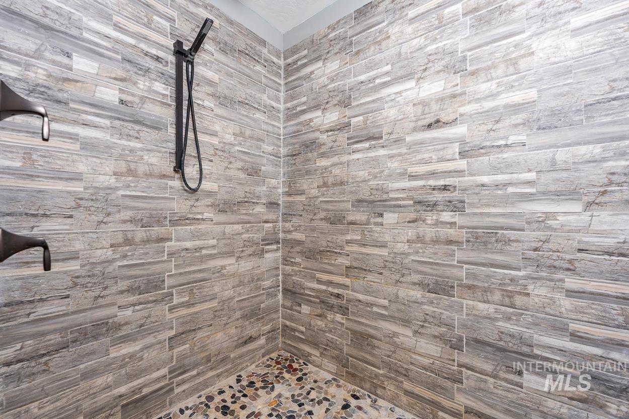 Full bath with tiled shower