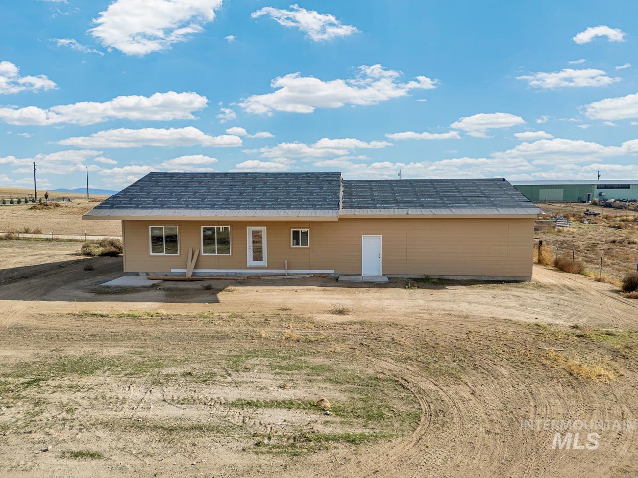 Rear view of property featuring a patio