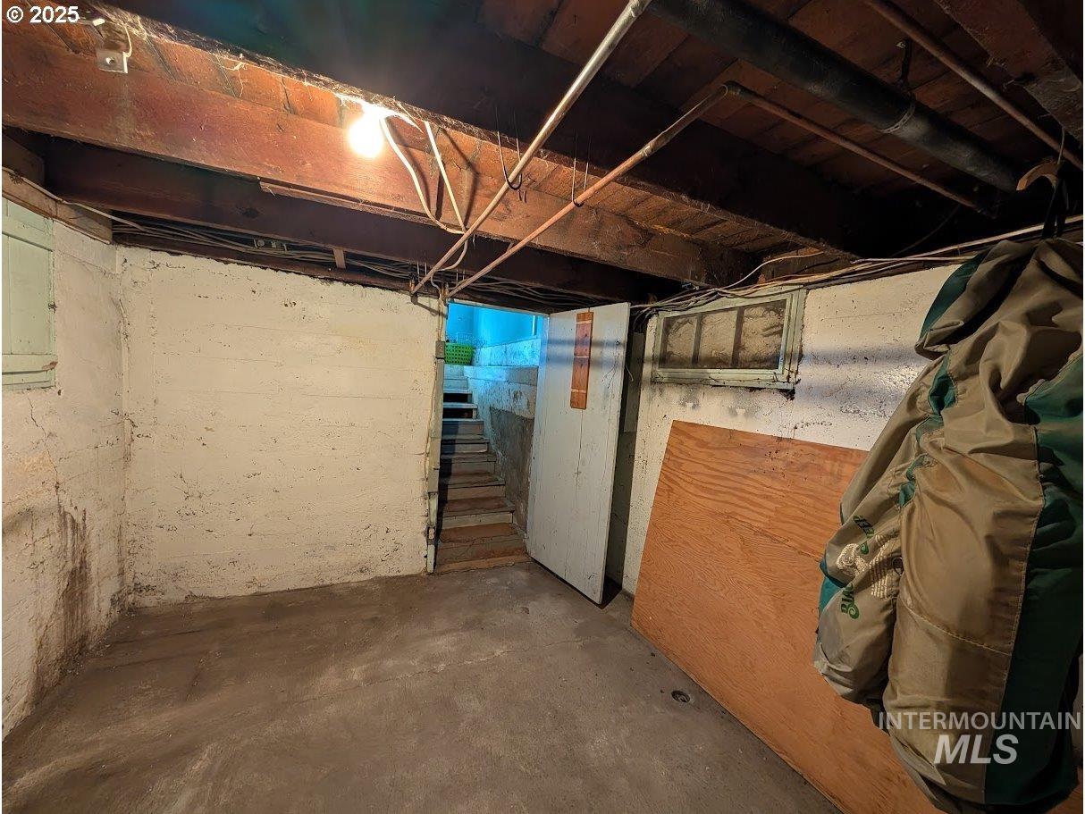 Unfinished basement with stairs