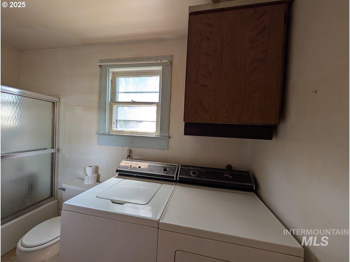 Laundry room featuring washer and dryer