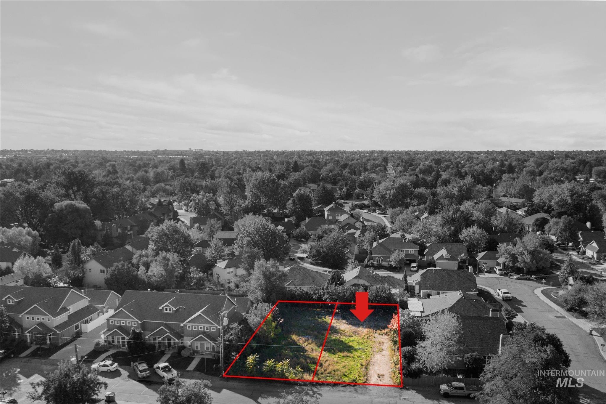 Aerial view of residential area with property boundaries highlighted