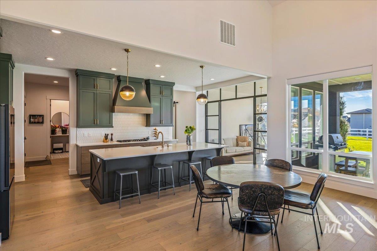 Dining space featuring light wood-style flooring and recessed lighting