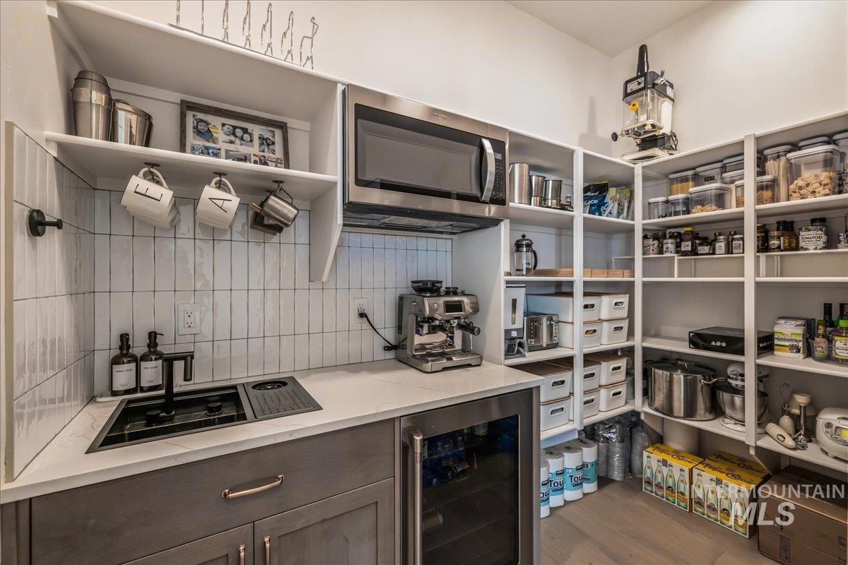 Storage area with beverage cooler and a sink