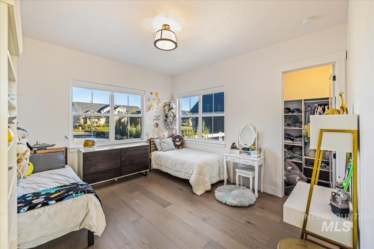 Bedroom featuring hardwood / wood-style flooring and a closet