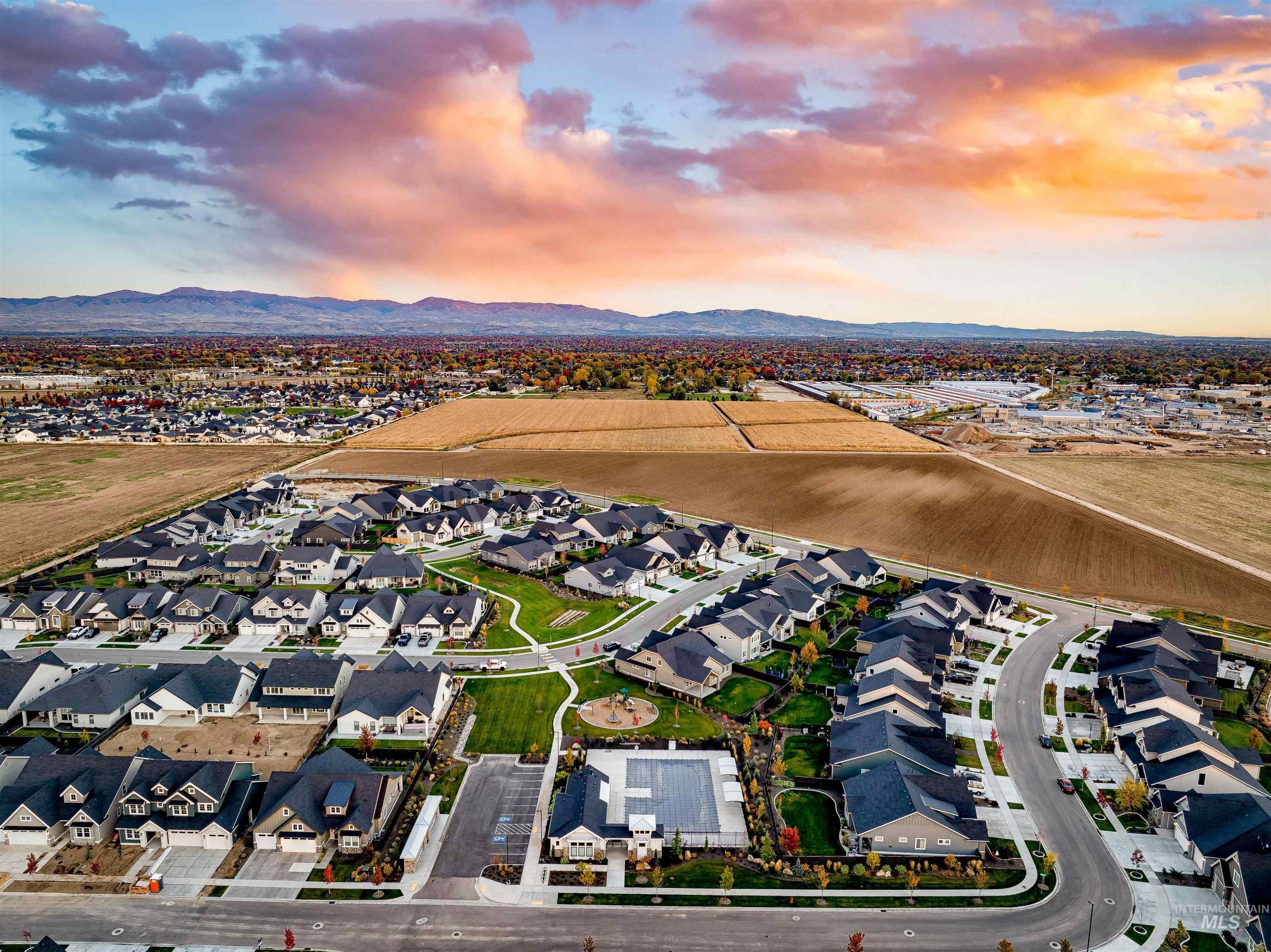 Aerial view at dusk of a residential view and a mountain view