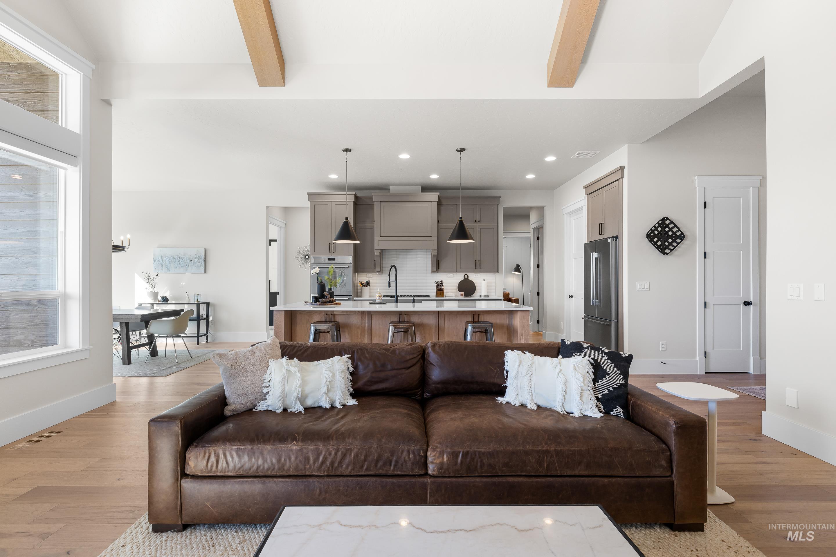Living area featuring light wood-type flooring and recessed lighting