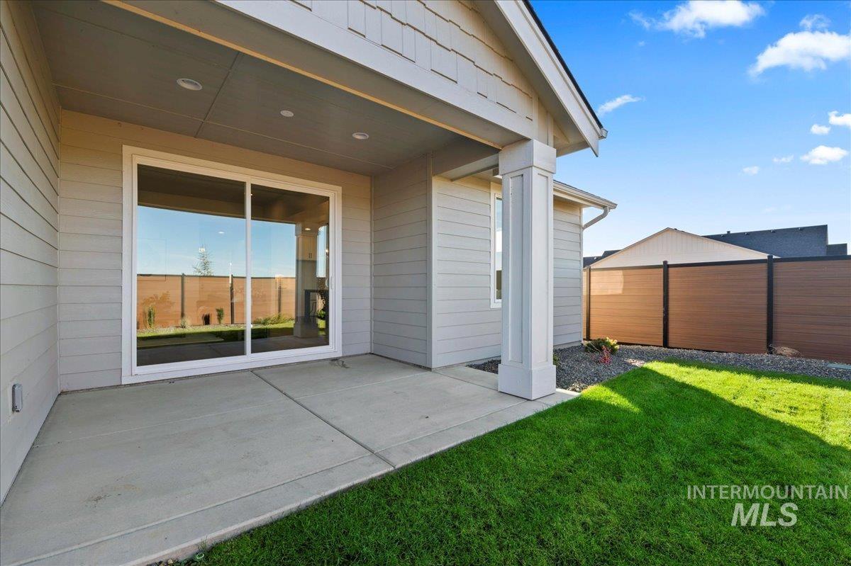 Rear view of property with a patio area