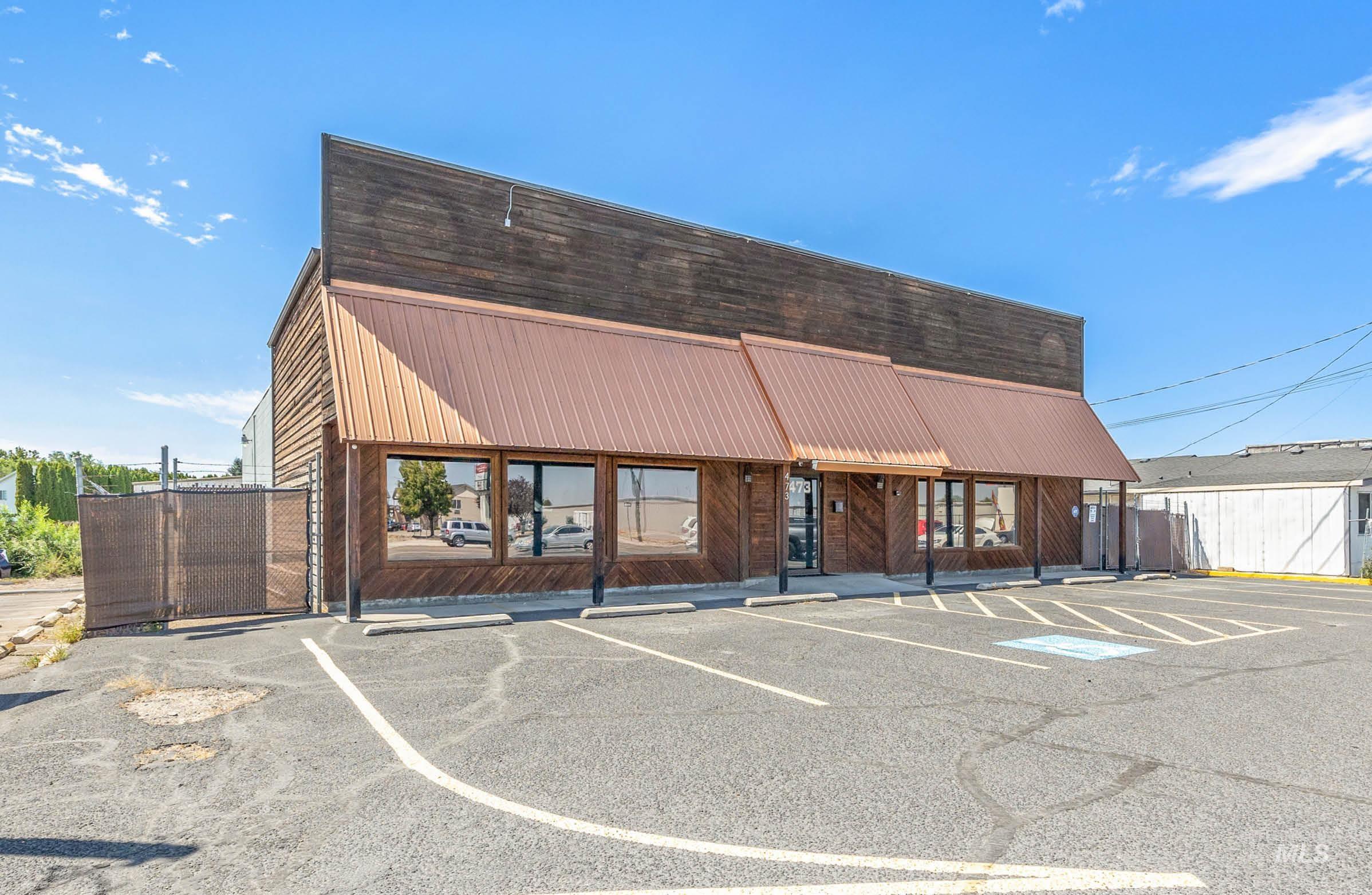 View of commercial location with uncovered parking