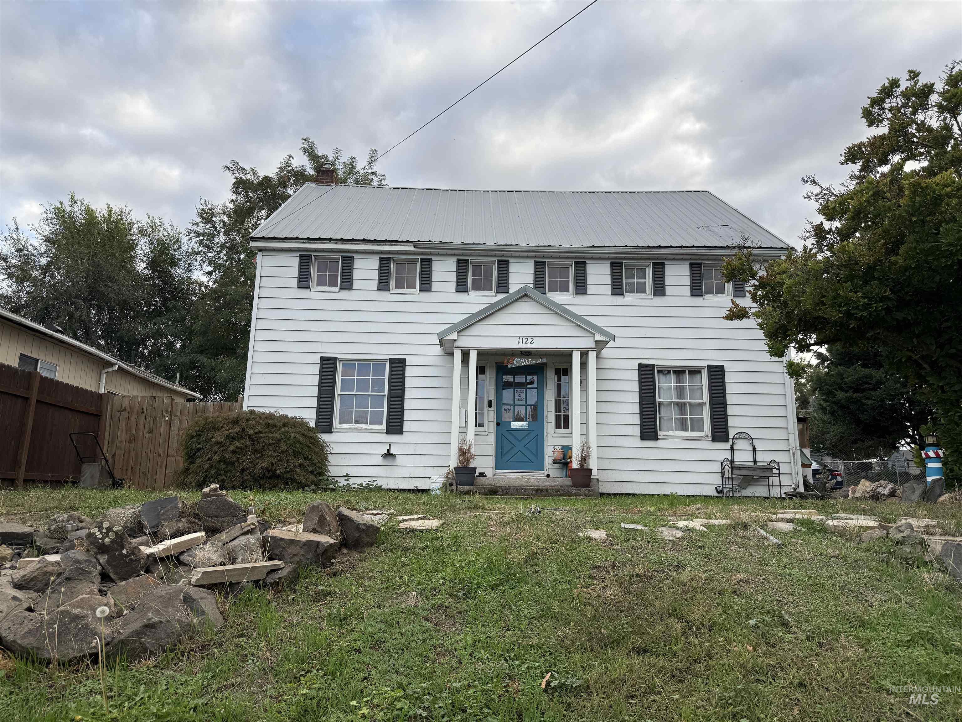 Colonial home with a metal roof