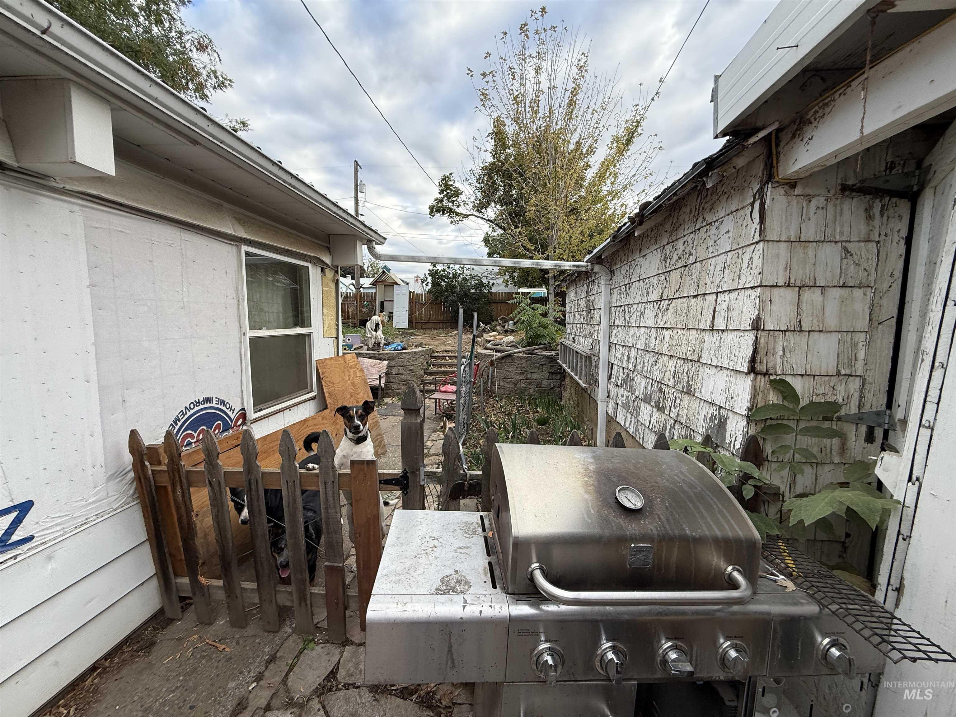 View of patio featuring a grill
