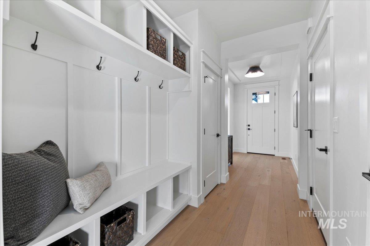 Mudroom with light wood finished floors