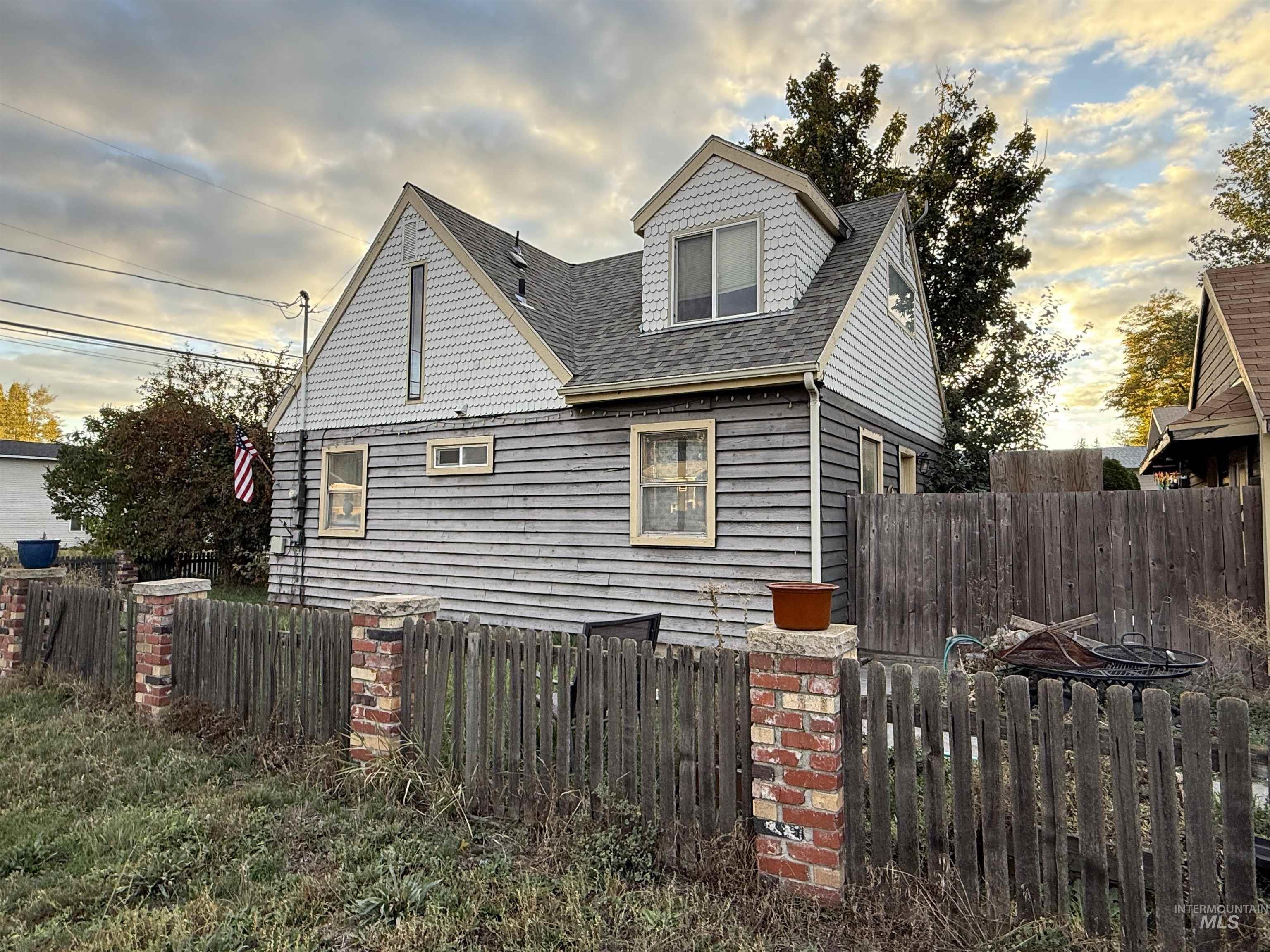 View of home's exterior with a shingled roof
