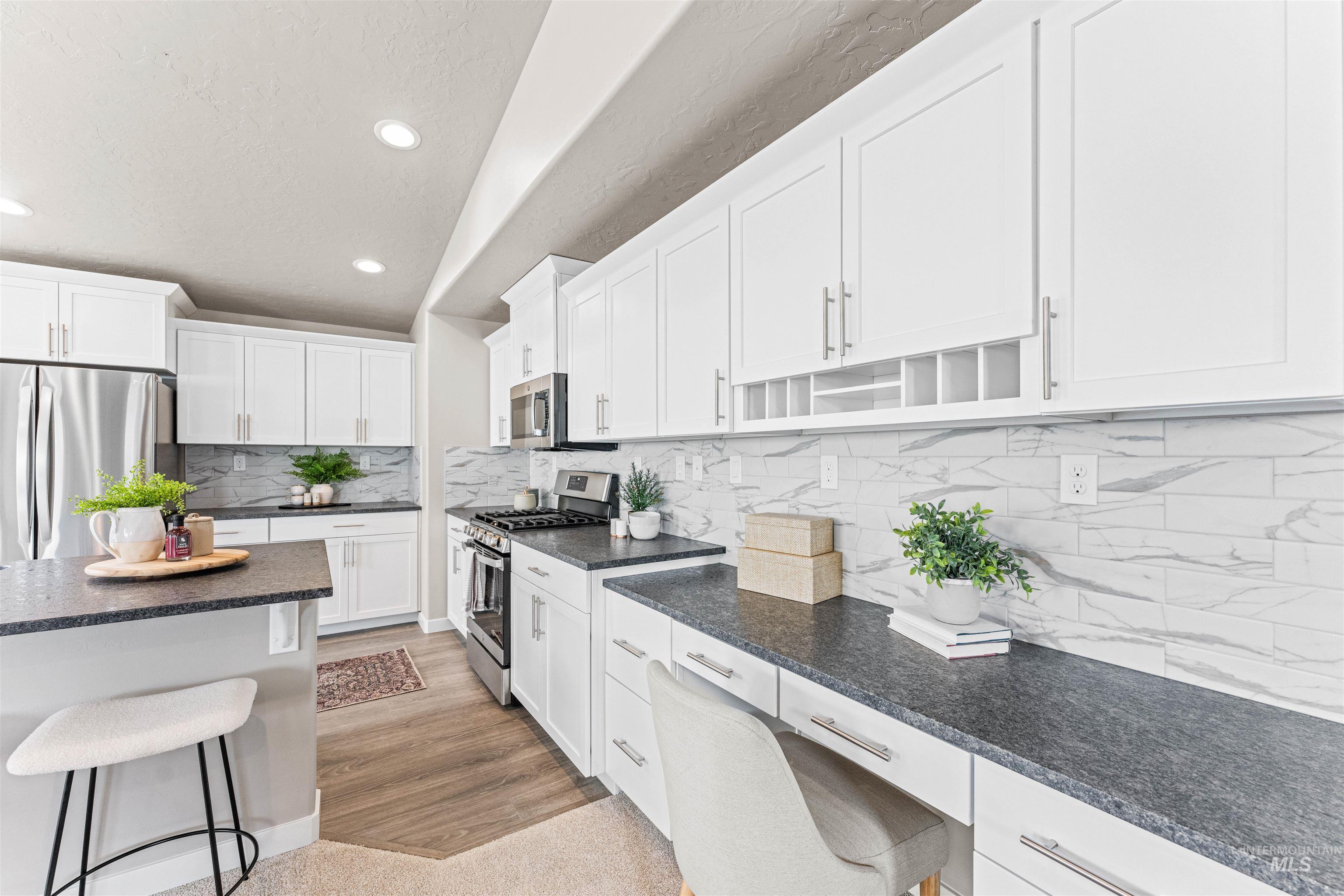 Kitchen with open shelves, stainless steel appliances, backsplash, recessed lighting, and white cabinets