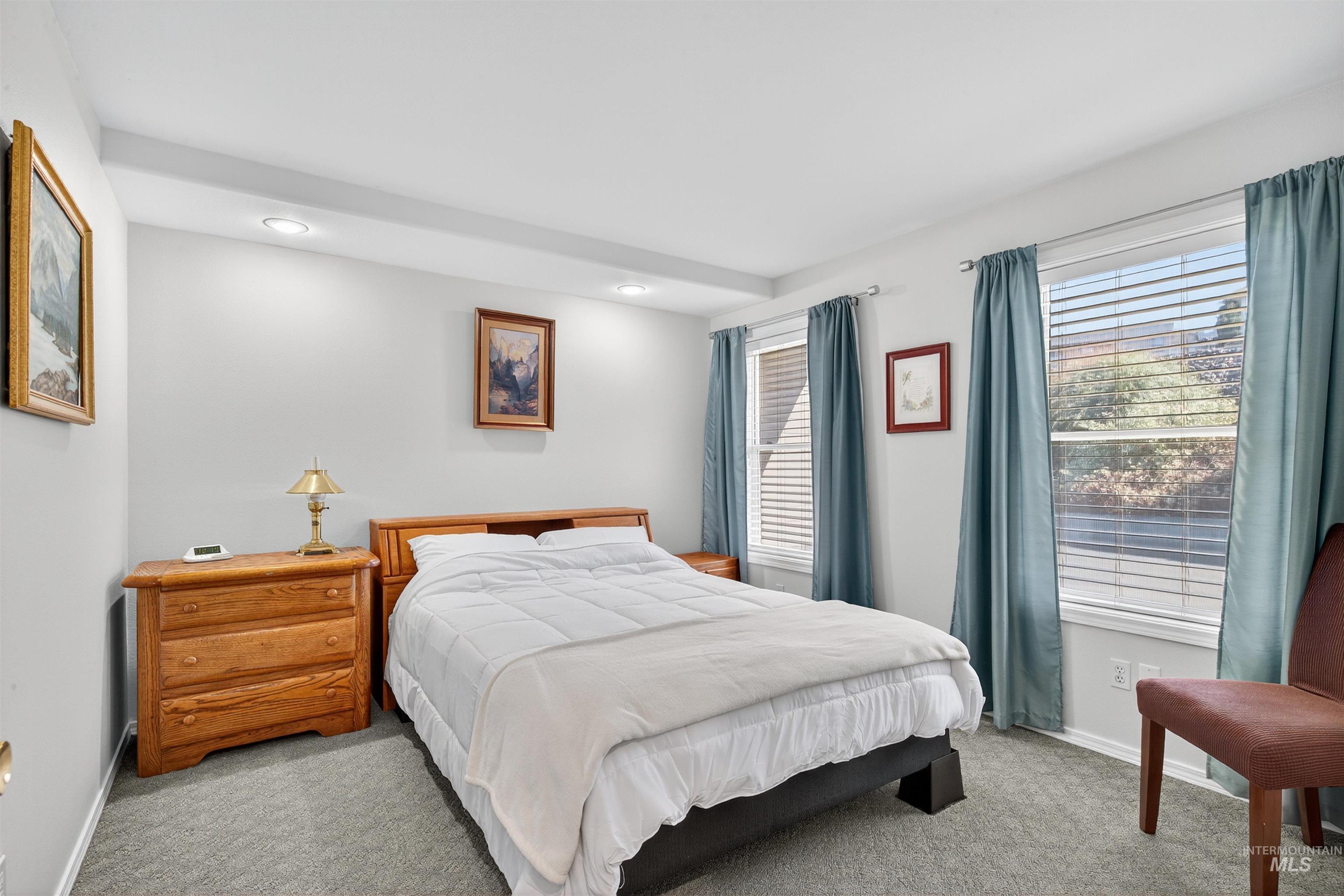 Bedroom with carpet and baseboards