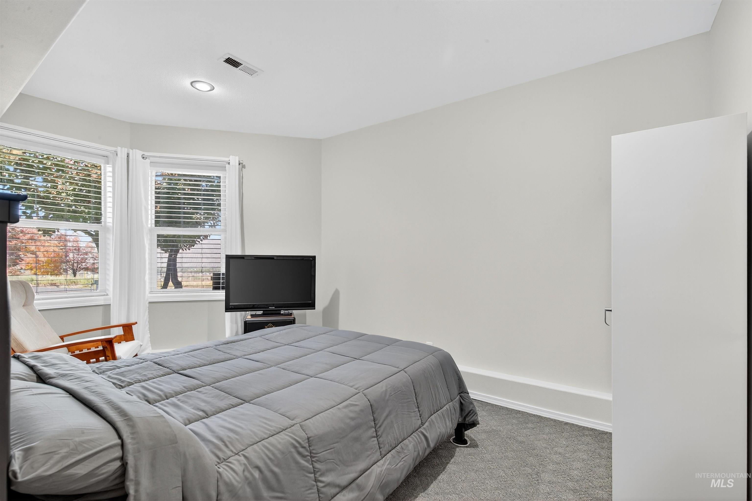 Bedroom featuring carpet and recessed lighting