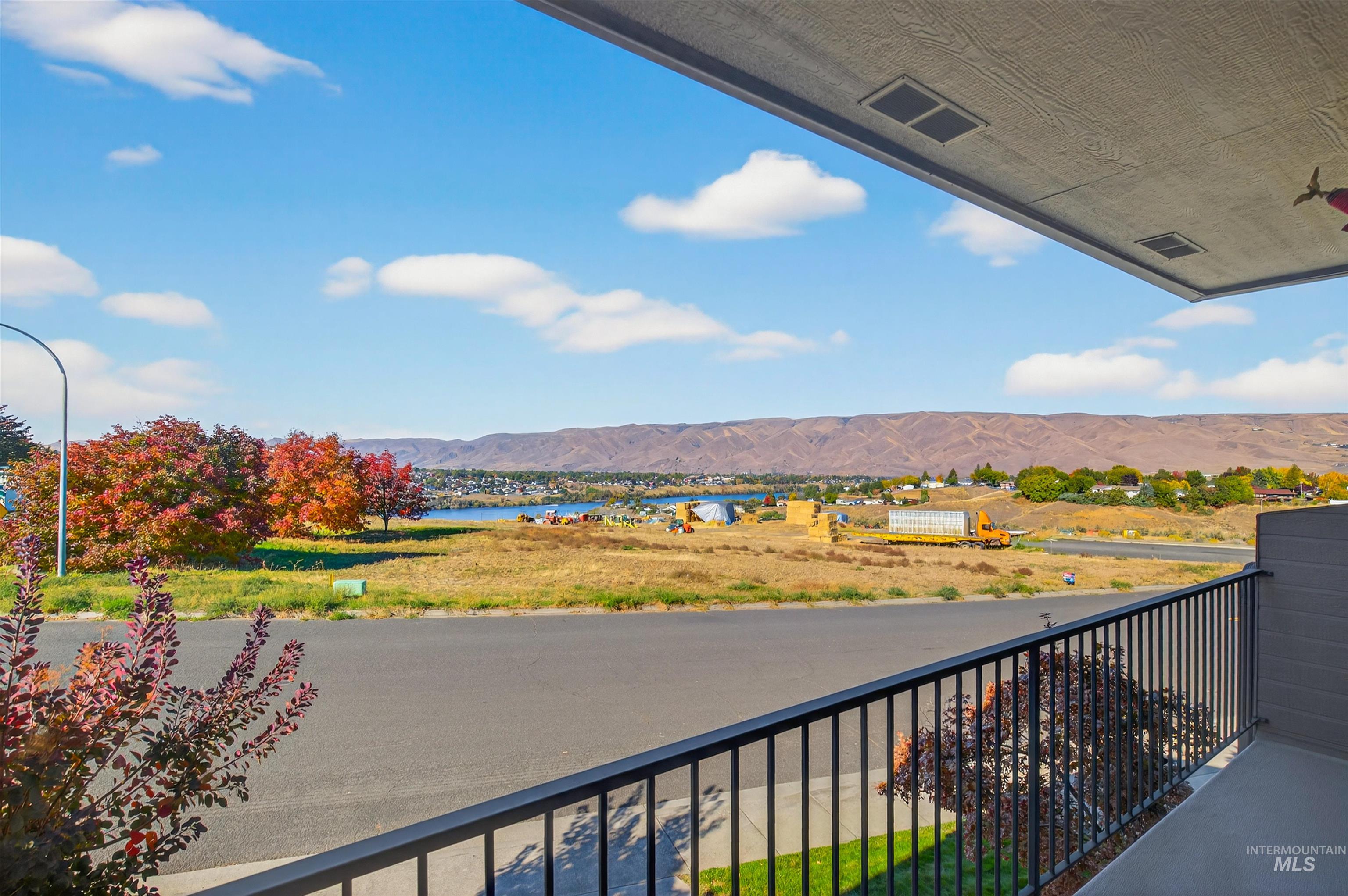 Balcony with a water and mountain view