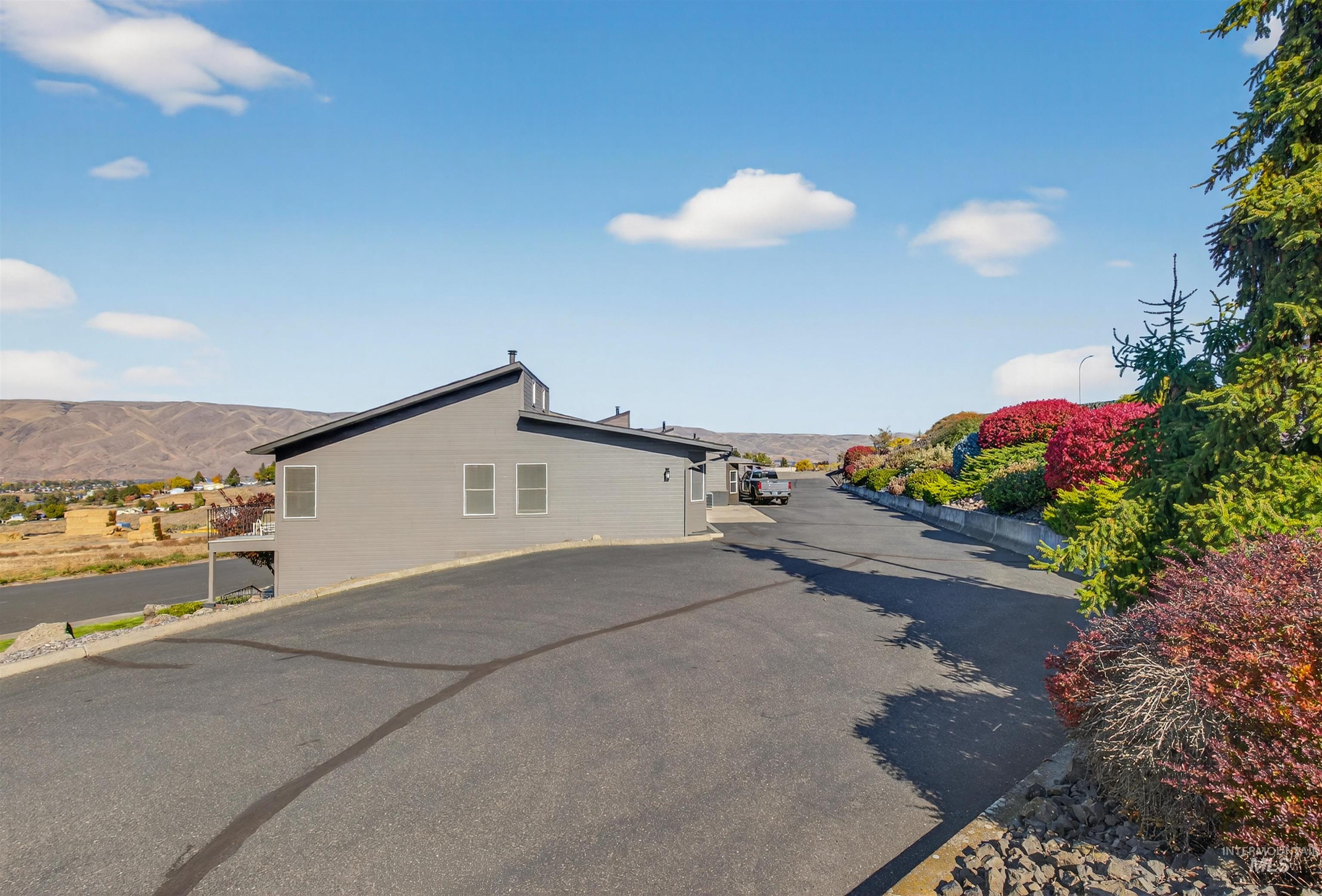 View of side of property with a mountain view