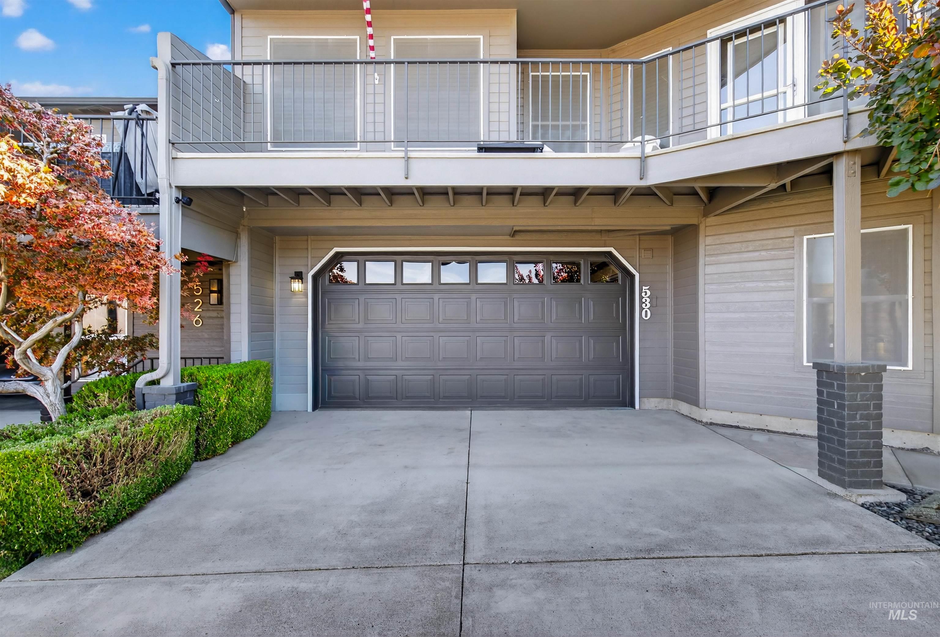 Garage featuring concrete driveway