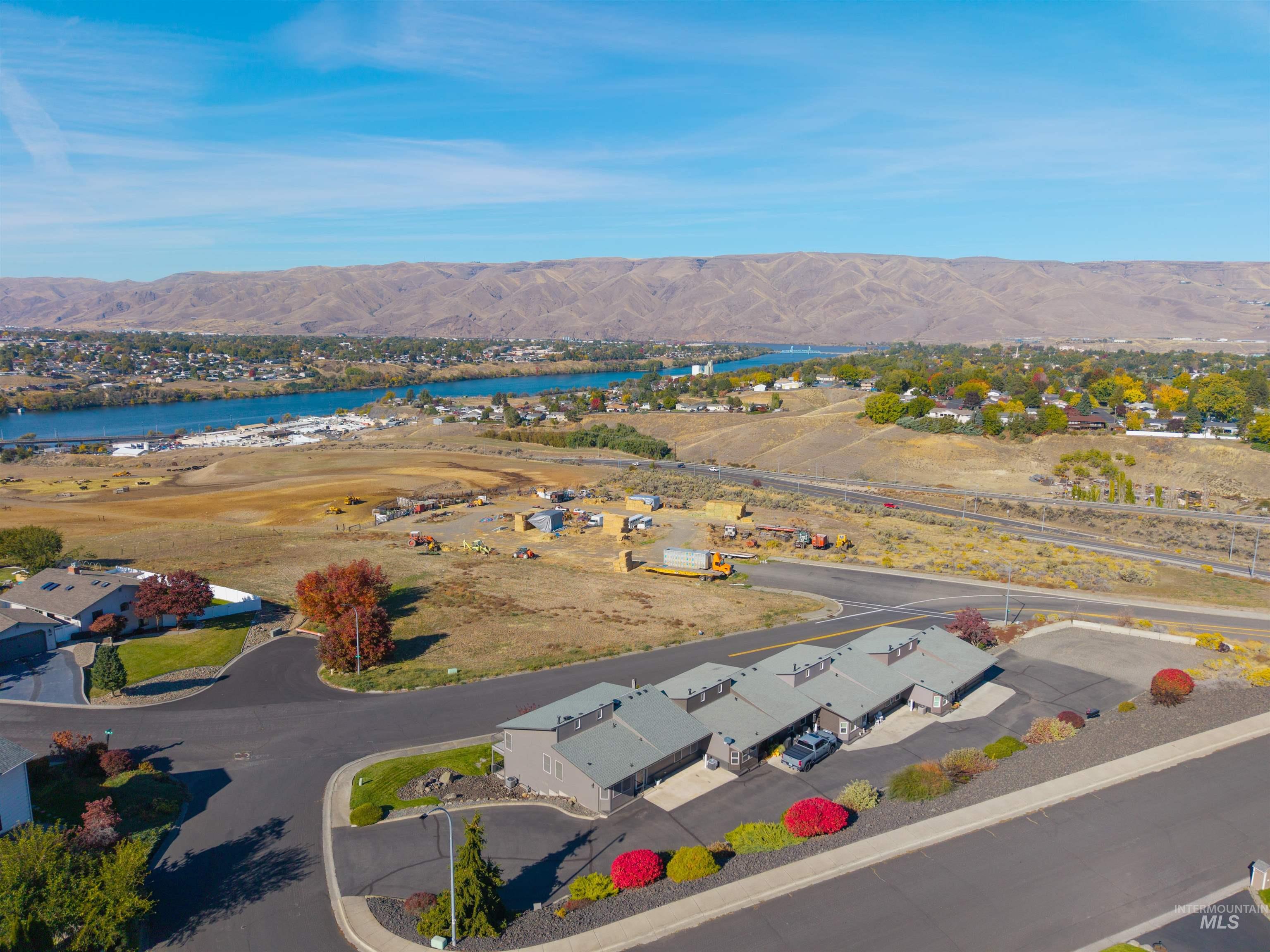 Aerial perspective of suburban area featuring a water and mountain view