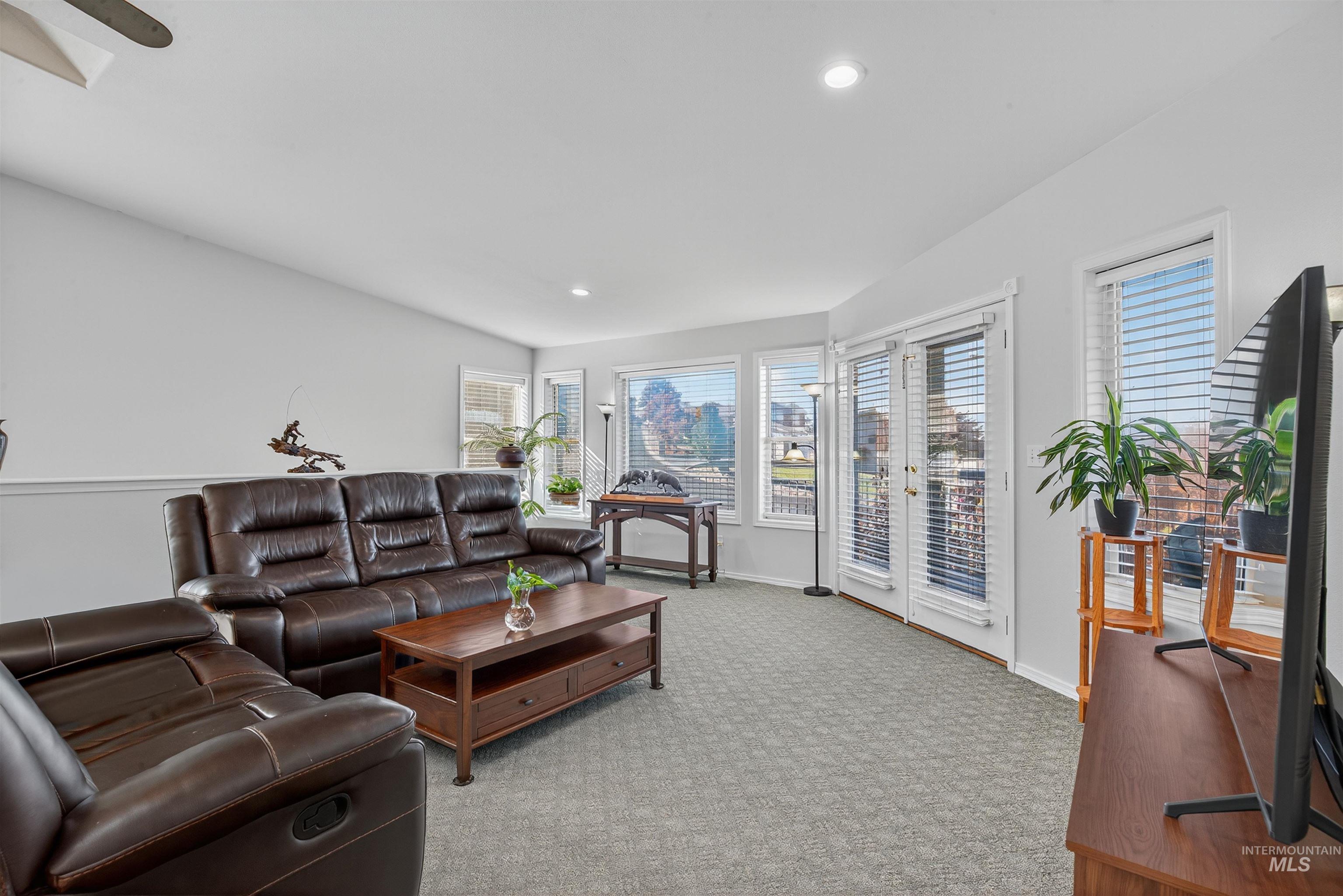 Living room featuring light carpet and recessed lighting
