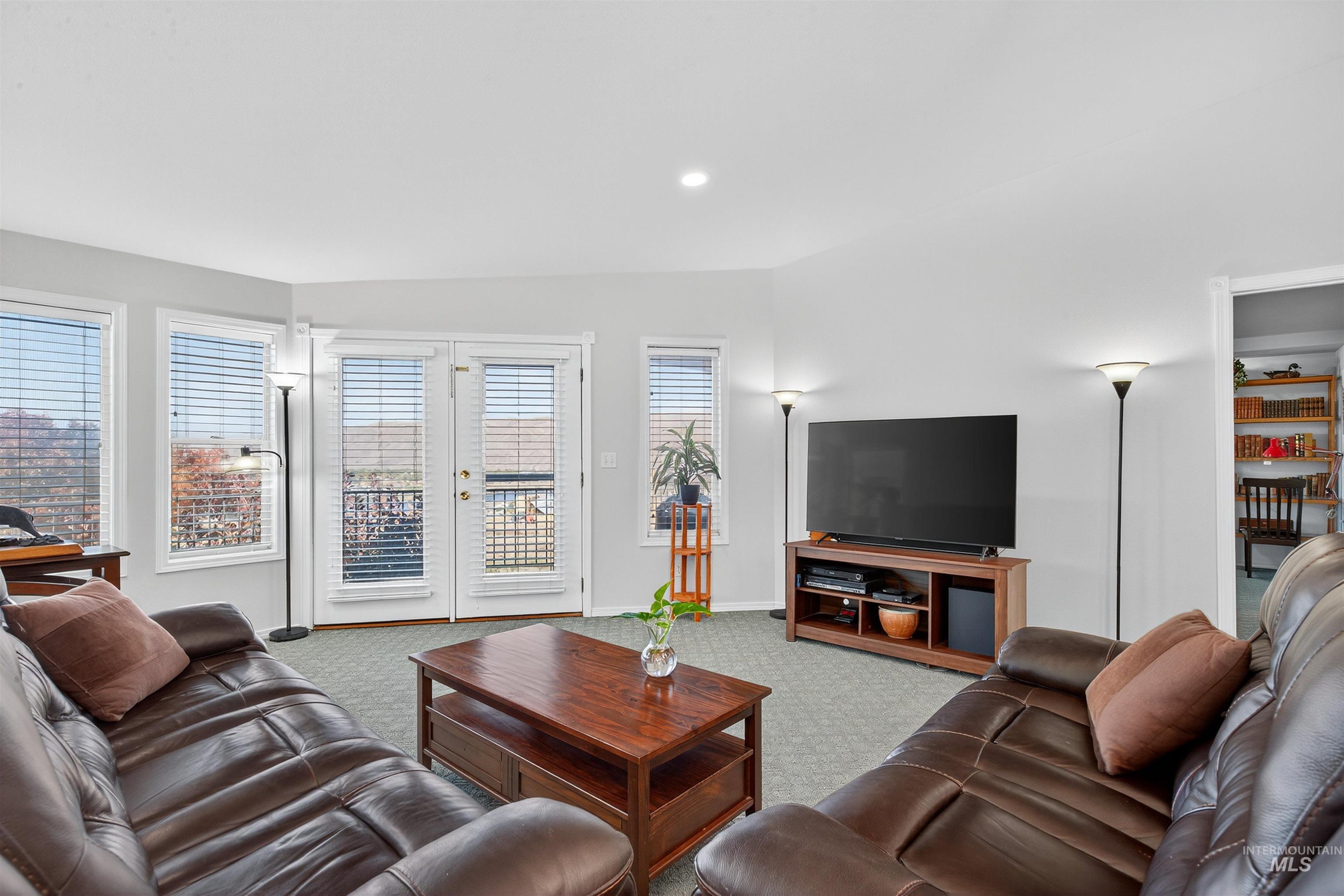Living area featuring carpet and recessed lighting