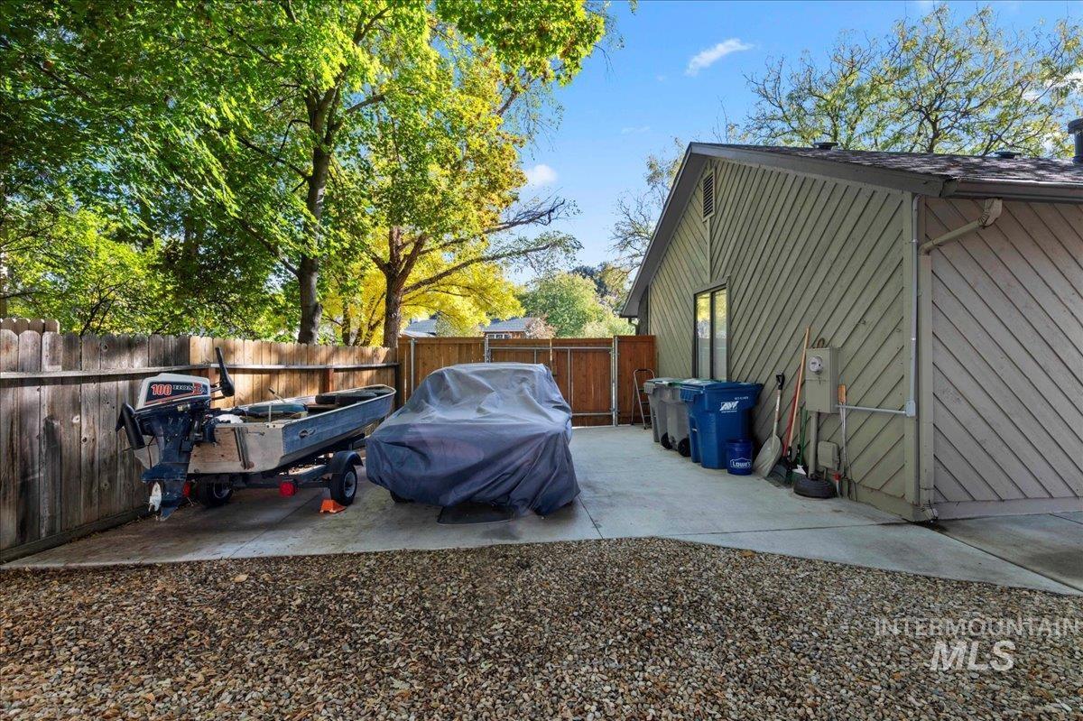 Fenced backyard with a patio area