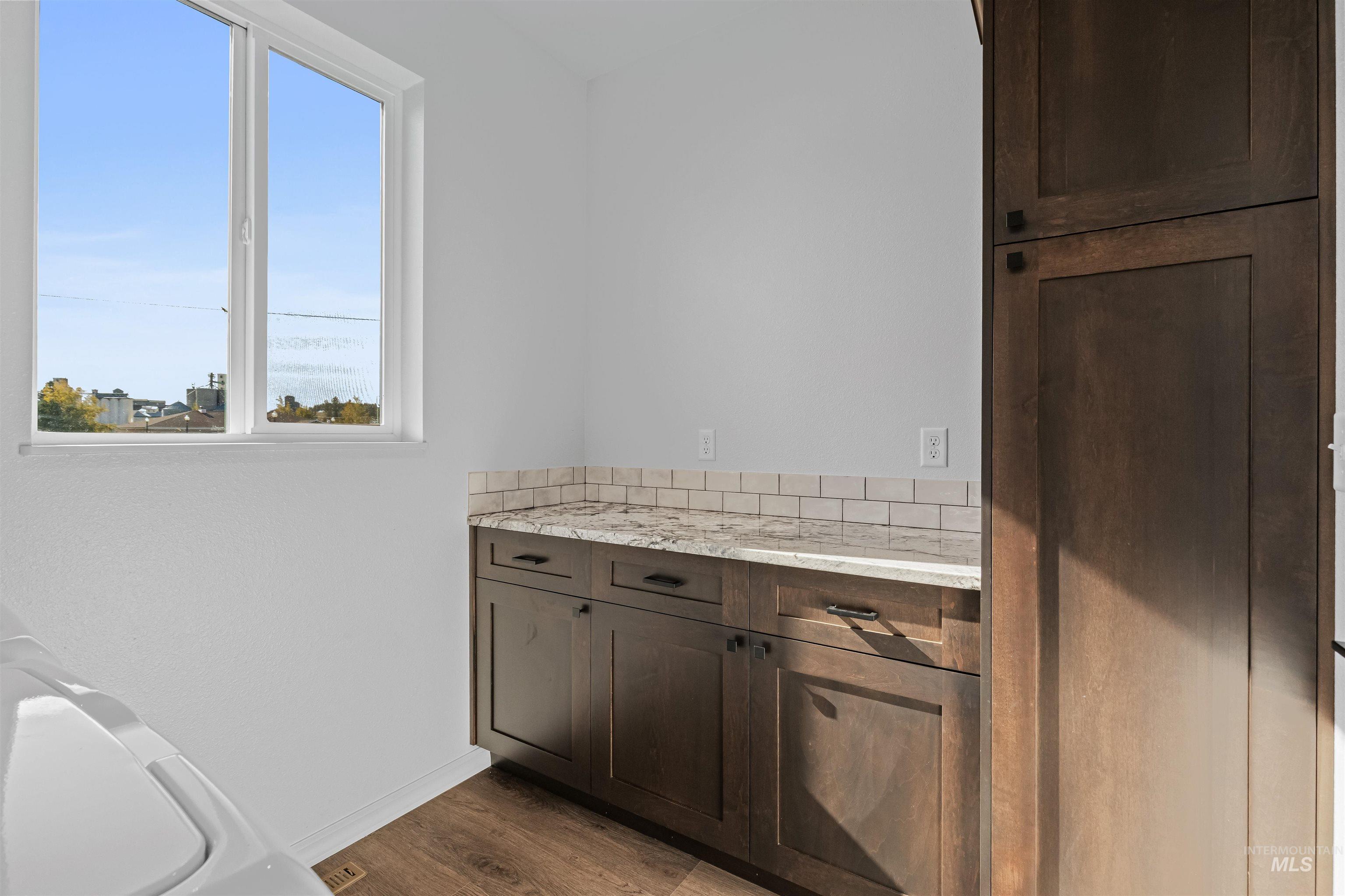 Bathroom featuring vanity and dark wood finished floors