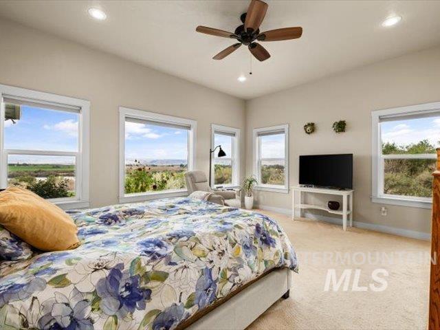 Bedroom with carpet flooring, recessed lighting, and ceiling fan
