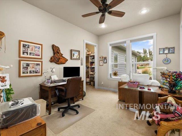 Office area with light carpet, ceiling fan, and recessed lighting