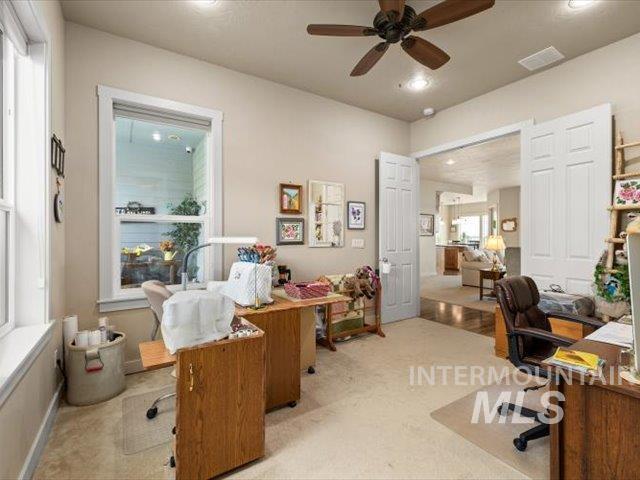 Office area featuring a ceiling fan and recessed lighting