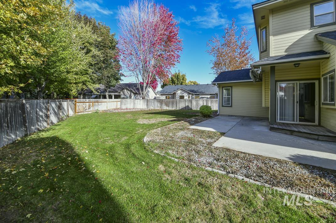 Fenced backyard featuring a patio